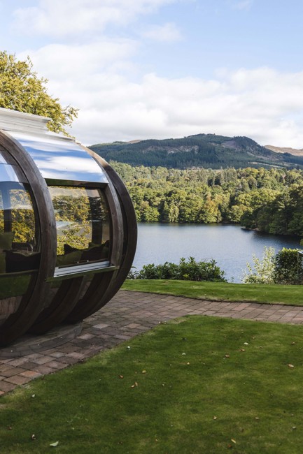 Fonab Castle | View of loch and pine trees from a dining pod at Fonab Castle Luxury Hotel Scotland  ?? Fonab Castle